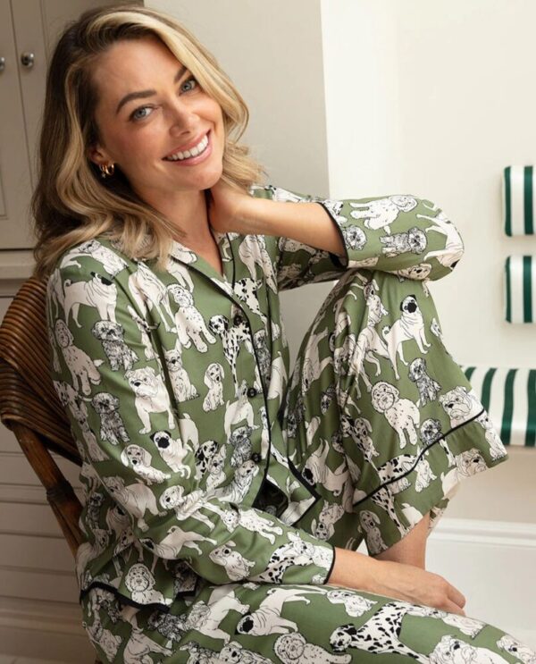 Woman lounging in Cyberjammies Nancy Green Dog Pyjamas – ideal for dog lovers and cozy nights in