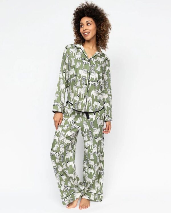 Model wearing Cyberjammies Nancy Green Dog Pyjamas with dog print and classic button-up top